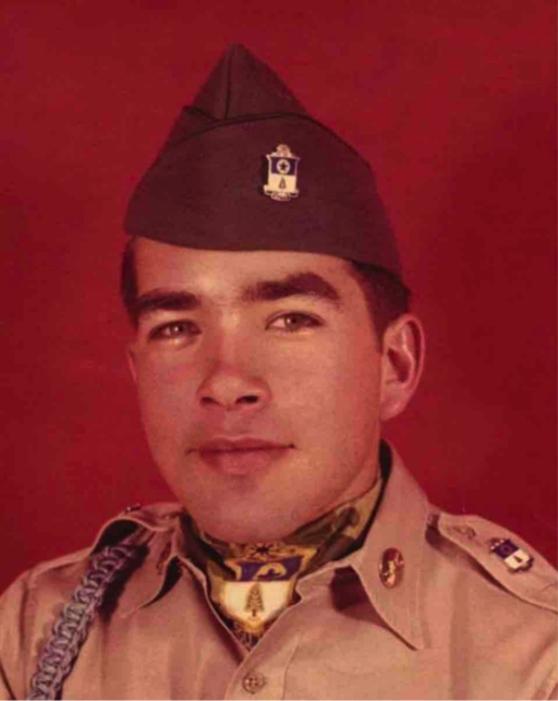 Color photo portrait of young man in Army uniform in front of a red background