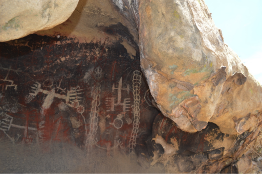 Polychromatic images painted and etched under a natural rock overhang